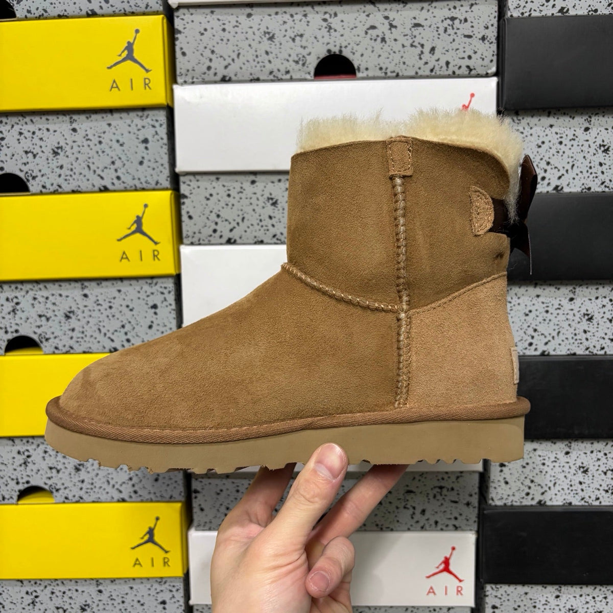 UGG Mini Bailey Bow Ankle Boot – Suede Boot with Cream Shearling Lining, Dark Chocolate Satin Bow & Tan Sugar Sole in Chestnut